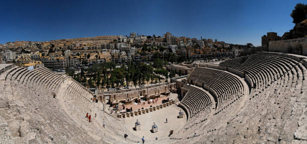 Roman amphitheatre "Panoramatic shot of the roman amphitheatre in Amman, Jordan" ancient rome stock pictures, royalty-free photos & images