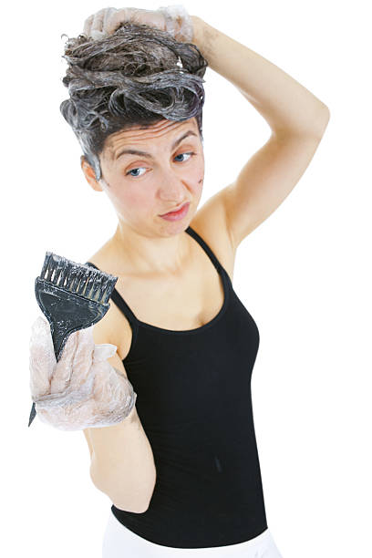 istock Unhappy Woman dyeing hairs 172343702