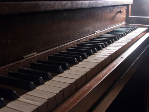 A dusty old piano.  Well-loved and oft-played.