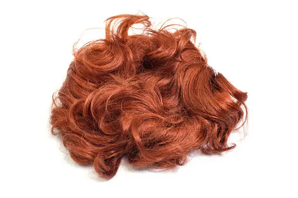 Red wig isolated on white
