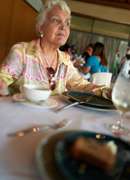 istock Enjoying afternoon tea with an older lady at a nice restaurant. 1723445815