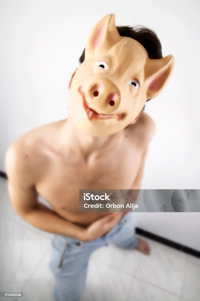 don't call me a pig portrait of young guy with a pig mask Active Lifestyle Stock Photo