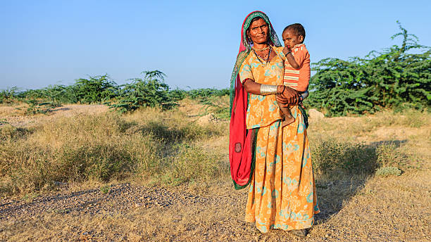 istock Indian woman holding her child 172345233