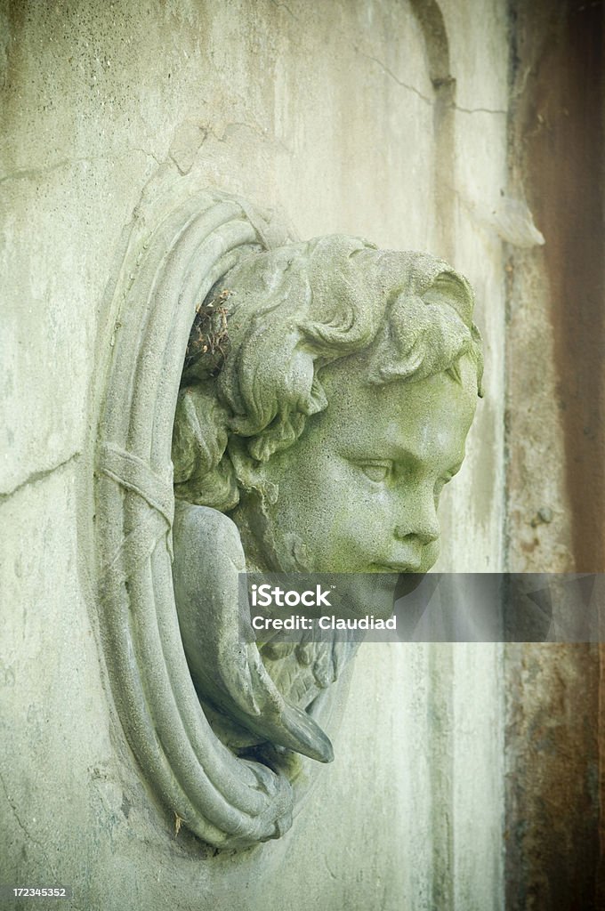 Angel in wall "Scultpure on cemetary, see my other pics:" Broken Stock Photo