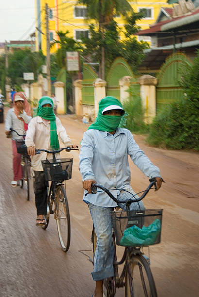 Cambodian Women Bicycling stock photo