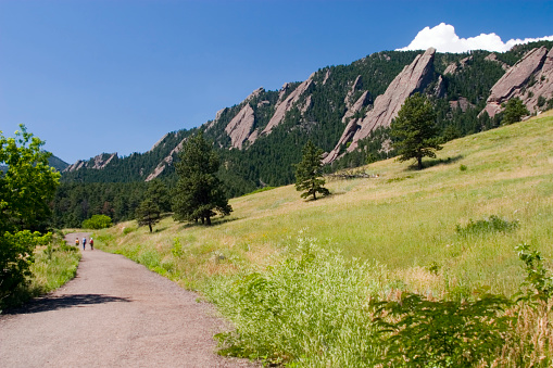 Hikers in the Boulder Flatirons on a beautiful Colorado summer day.