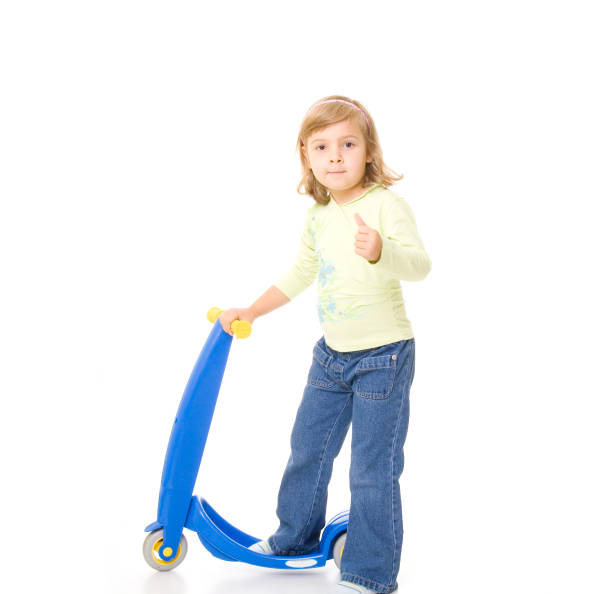istock little girl on her scooter 172346239