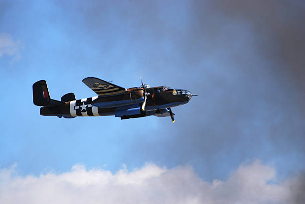 istock WWII B25 bomber airplane flying in sky 172346333