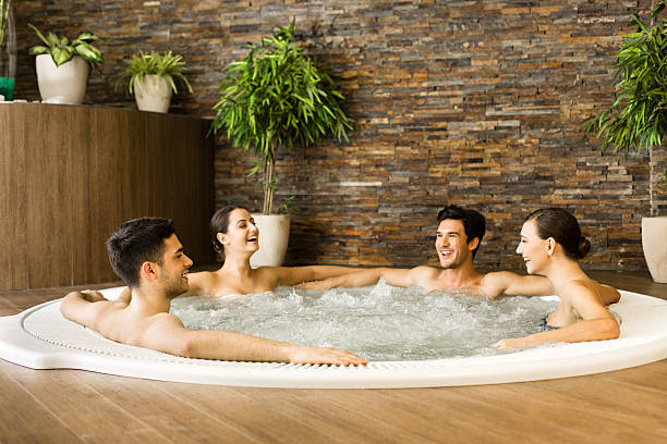 istock Friends having fun in hot tub 172347068