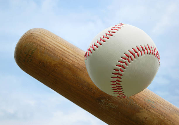 Wooden bat hitting a baseball with red stitching baseball home run photos stock pictures, royalty-free photos & images