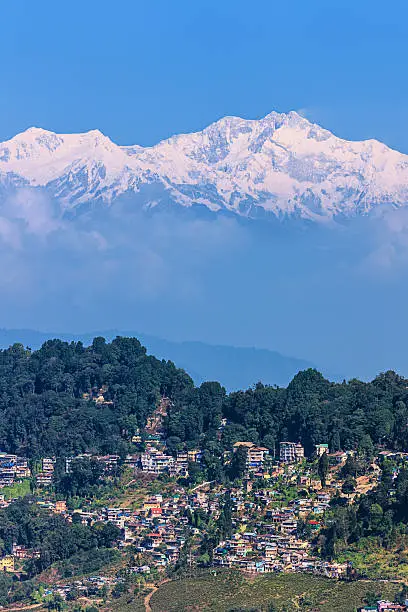 "Panoramic view of Darjeeling with mount Kanchengjunga in the background. Kangchenjunga is the third highest mountain in the world, with an elevation of 8,586 m and located along the India-Nepal border in the Himalayas."