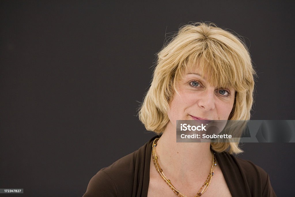 Cute Mom! A cute blonde mom in her early fortiesMore pictures from the series FAMILY LIFE: 35-39 Years Stock Photo