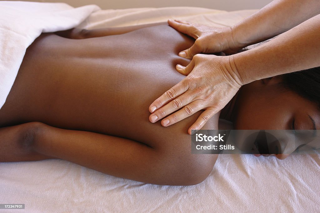 Young woman getting a deep tissue massage               massage therapy bodywork     Shiatsu Stock Photo