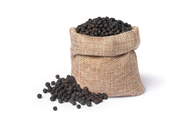 istock Black peppercorns (Black pepper) seeds in burlap sack bag isolated on white 1723480003