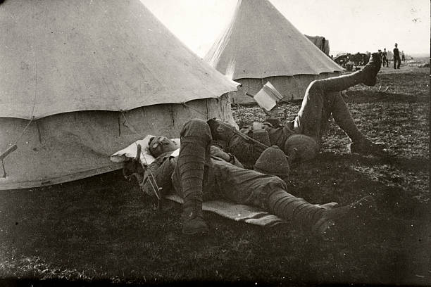 Soldier relaxing Two British soldiers relaxing outside their tent. barracks photos stock pictures, royalty-free photos & images