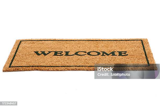 Brown Door Mat With Welcome Written Across In Black Stock Photo - Download Image Now