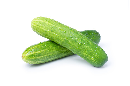 Fresh cucumber with water drplets  isolated on white background with clipping path.