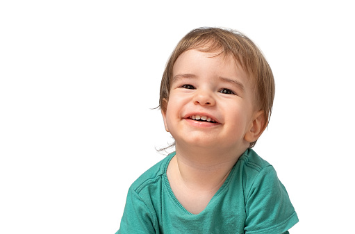 Portrait of a cute cheerful child looking at the camera close isolate on a white background
