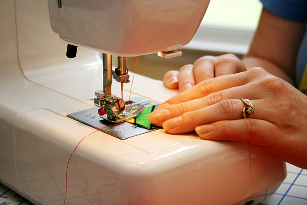 istock A woman sewing on a sewing machine 172349009