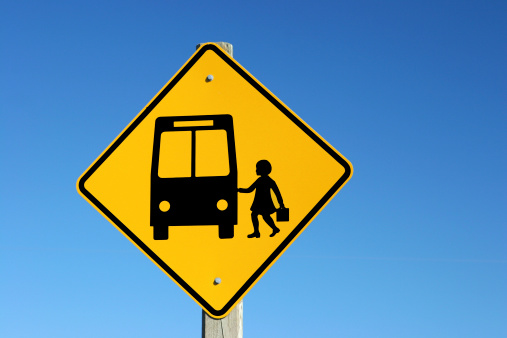 A warning sign for a school bus