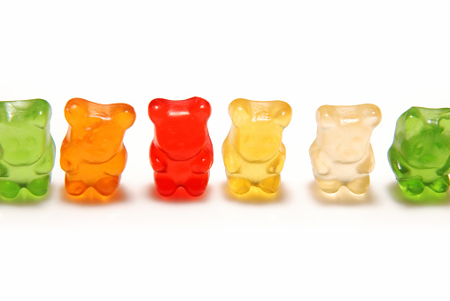 Collection of colorful jelly gummy bears isolated on a white background. Fruit flavored gummy bears.