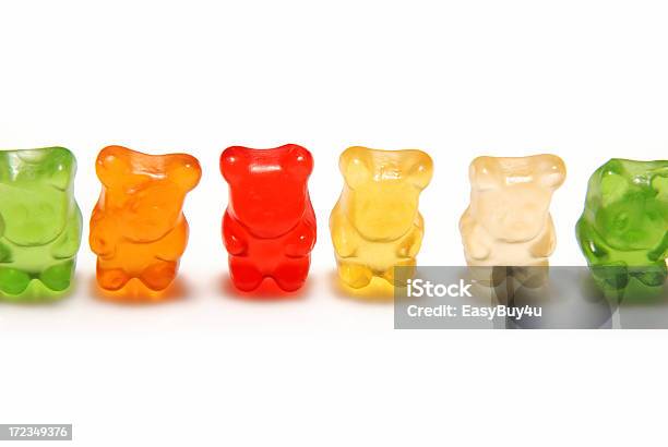 Various Colors Of Gummy Bears Lined Up Isolated On White Stock Photo - Download Image Now