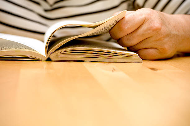 istock Senior woman reading a book 172349457
