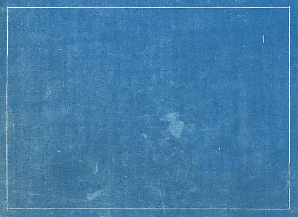 Photo of Grunge blue print texture with white line border