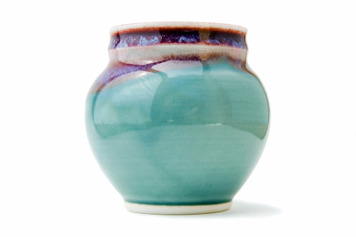 Handmade pottery vase on white