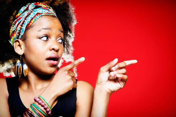 istock Wide-eyed young woman points to the side 172349789