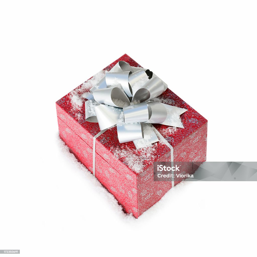 Christmas gift in a snow (isolated) Christmas gift in a snow. Isolated on white. Box - Container Stock Photo