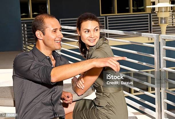 Adult Couple Sitting Outdoors Stock Photo - Download Image Now - 20-29 Years, 30-39 Years, Adult