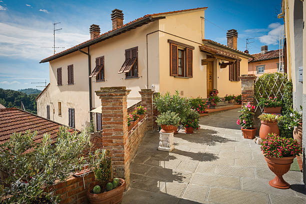 Beautiful street with flowers in Viltigiano, Florence province, Tuscany, Italy.
