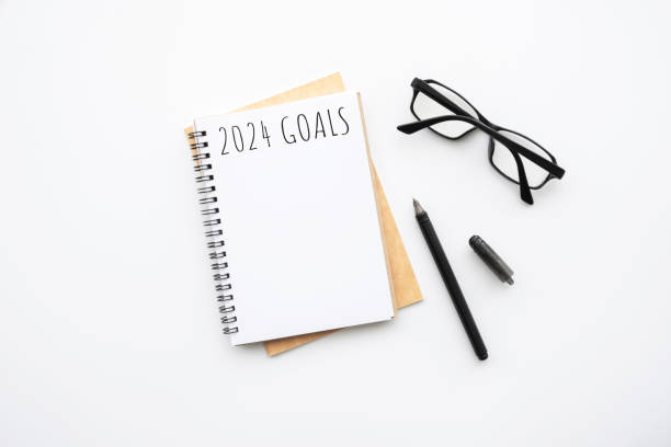 istock Notebook with 2024 goals text on it to apply new year resolutions and plan. 1723512437