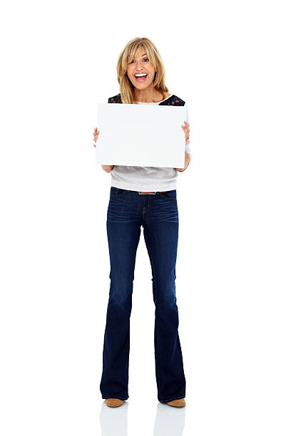 istock Mature woman holding a blank board laughing over white 172351258