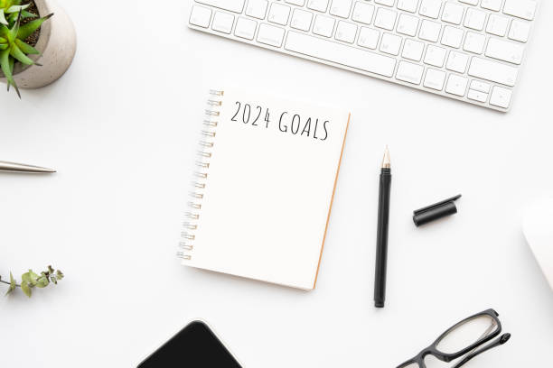 istock Notebook with 2024 goals text on it to apply new year resolutions and plan. 1723513182