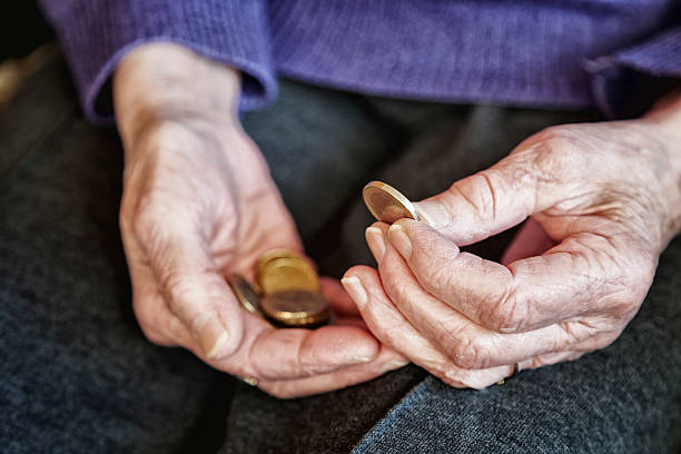 istock cost retirement senior hand counting money 172351600