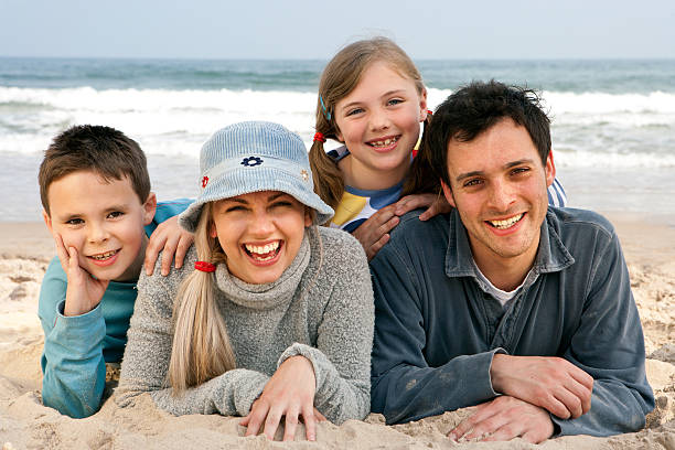 istock Family of four on beach 172352030