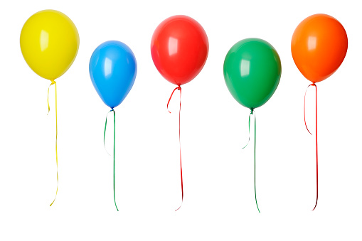 Row of colorful balloons in mid-air against white background