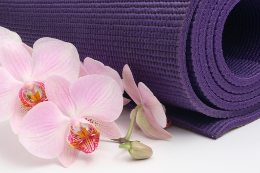 Yoga Mat with Orchid - isolated on white