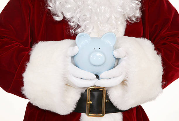 istock santa with piggy bank 172354775