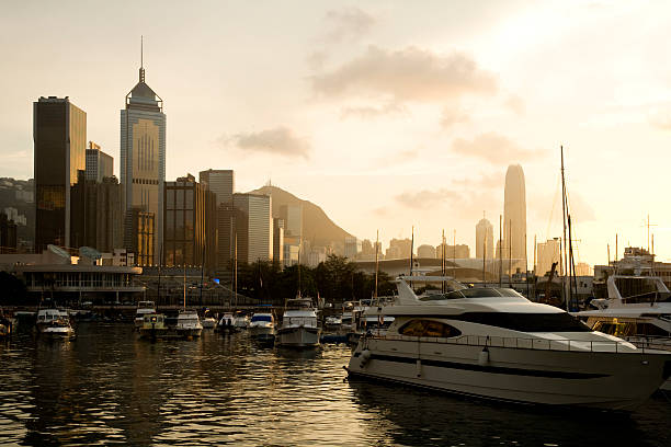 Photo of Hong Kong cityscape from waterfront harbor.