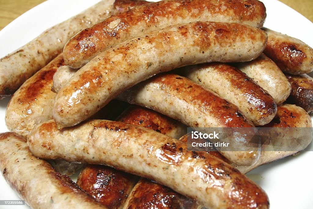 bratwurst a pile of sausages on a plate Bratwurst Stock Photo