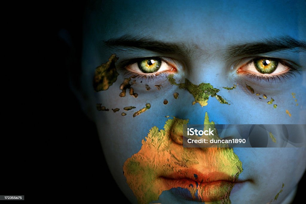 Earth boy - South Pacific Portrait of a boy with the map of the Pacific showing Papua New Guinea and the Pacific Island, and the top of Australia.  Australia Stock Photo