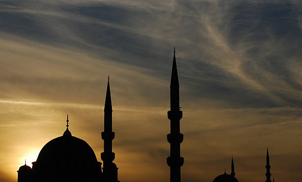 Minaret Istanbul silhouette, mosque, Yeni Cami, dramatic, beautiful sunset. azan stock pictures, royalty-free photos & images