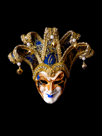 Carnival mask in hand, a theatrical and vintage accessory for a Mardi Gras celebration, black background, banner