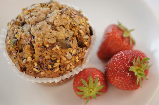 muffin and group of strawberries