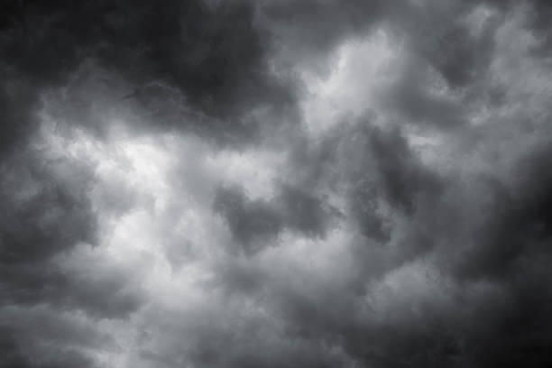 Moody Sky Colorized with a slight blue tint to even the hues. angry clouds stock pictures, royalty-free photos & images