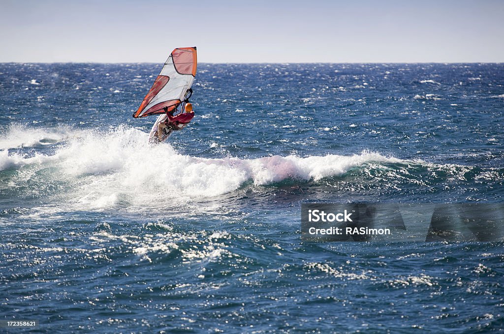 Air Hookipa Sailboard rider launches on this swell at Hookipa Beach Park on Maui. Above Stock Photo