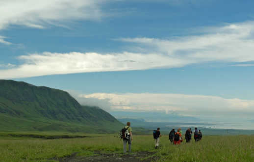 Description:A group of Hikers head down from the slopes of Ol Doinyo Lengai (the holy mountain of the Masai) to Lake Natron. On the left hand des Escarpment of the Rift Valley.Location: Nothern TanzaniaSee more of my photos of mountains in Africa: